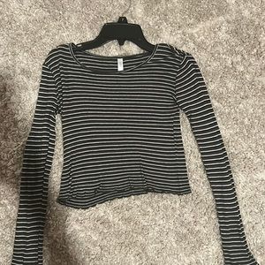 Green, black and white striped long sleeve cropped tee.
